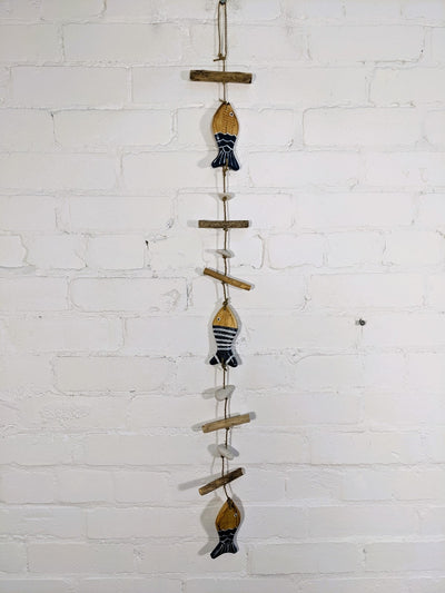String of Blue Fish and driftwood